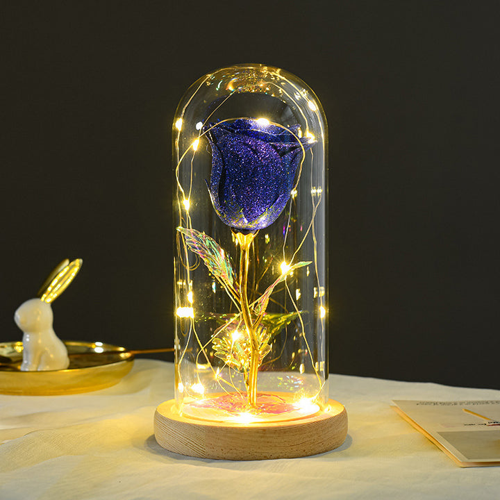 Preserved red rose in lit glass dome