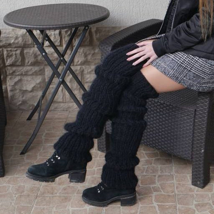 Chunky slouchy knitted leg warmers over boots