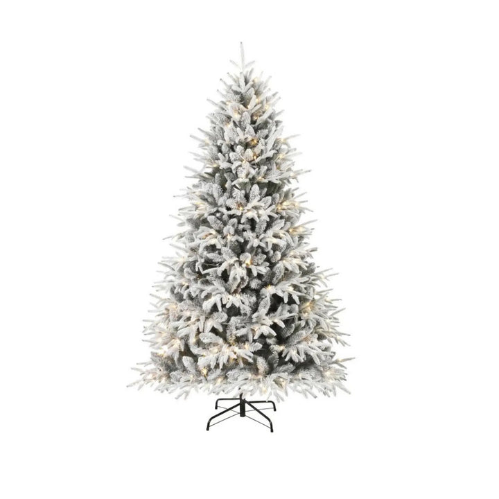 Full snow-flocked tree with warm LEDs