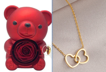 Rotating teddy bear jewellery box with eternal rose