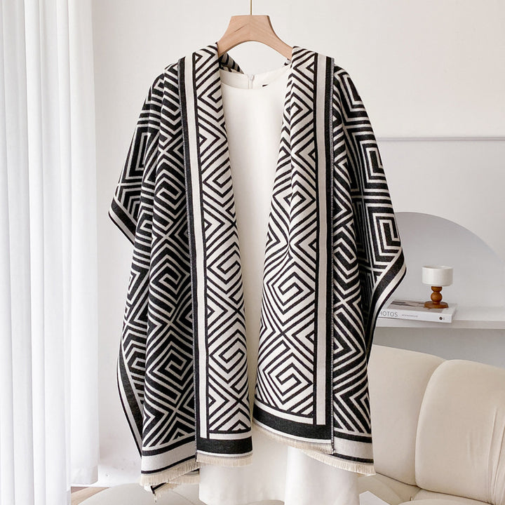 Woman wearing grey fringed shawl cape