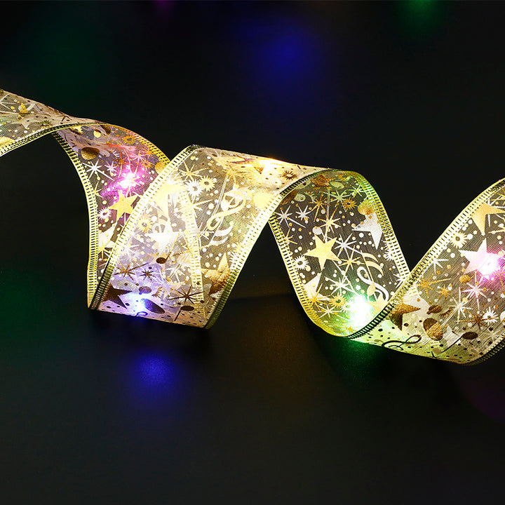 Gold ribbon fairy lights on Christmas tree
