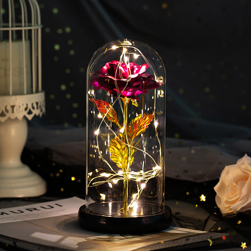 Enchanted rose in a glass dome with LED lights