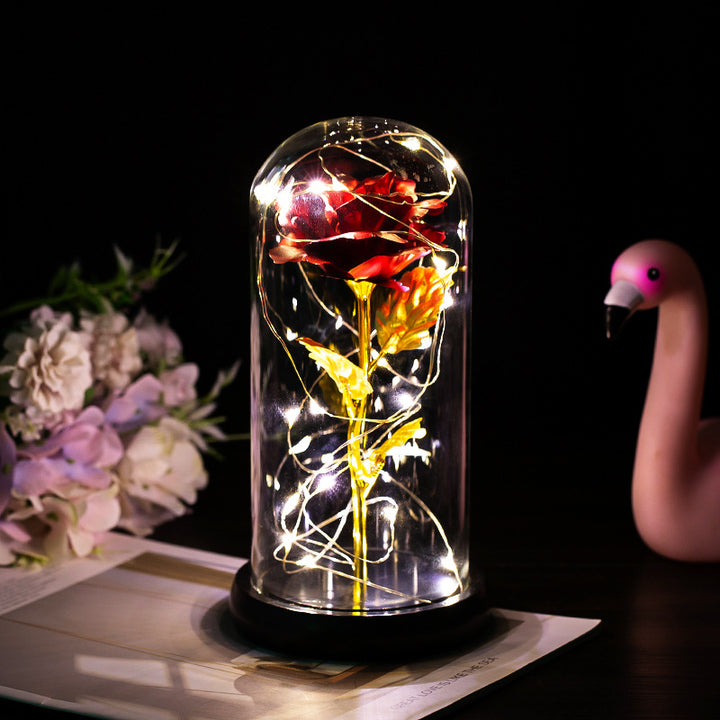 Enchanted rose in a glass dome with LED lights