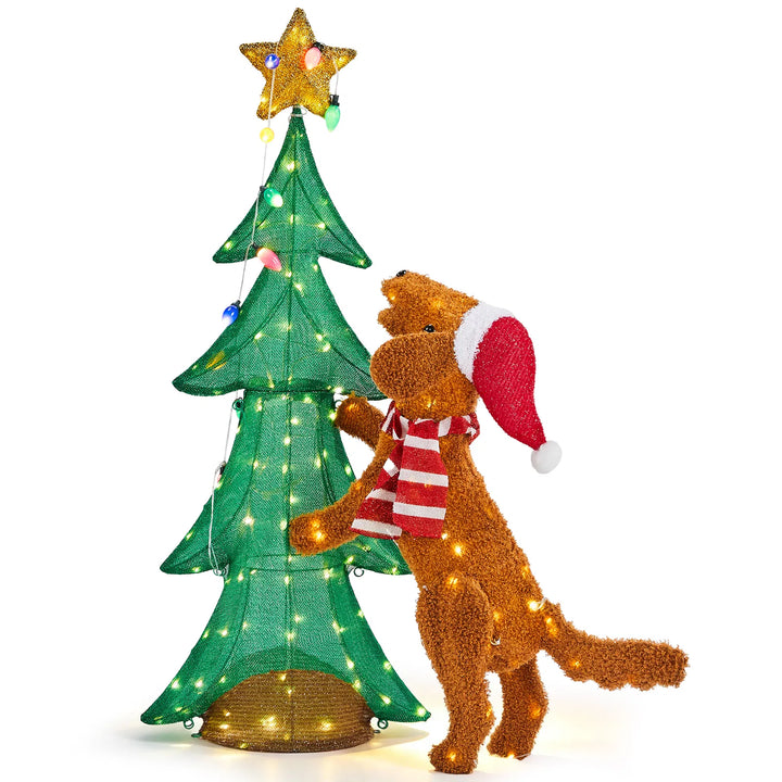Plush dog climbing a lit Christmas tree