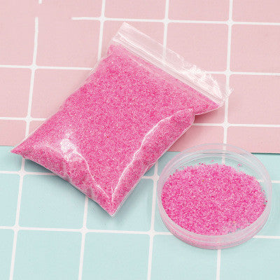Coloured magic sand shaped underwater