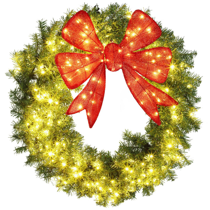 Large lit Christmas wreath with red bow
