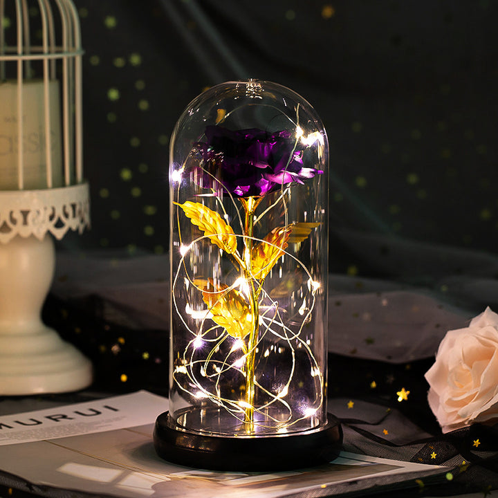 Enchanted rose in a glass dome with LED lights