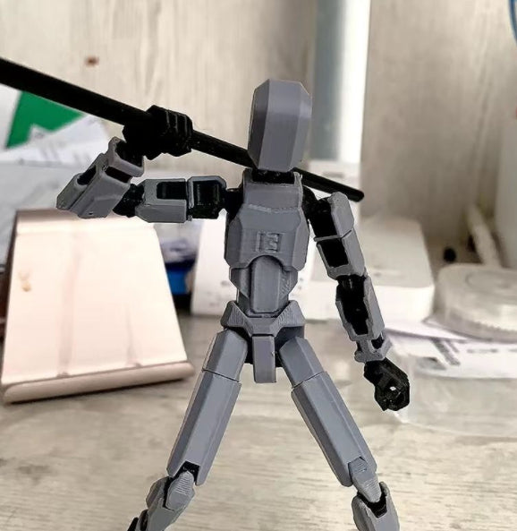 Poseable 3D printed robot figure on desk