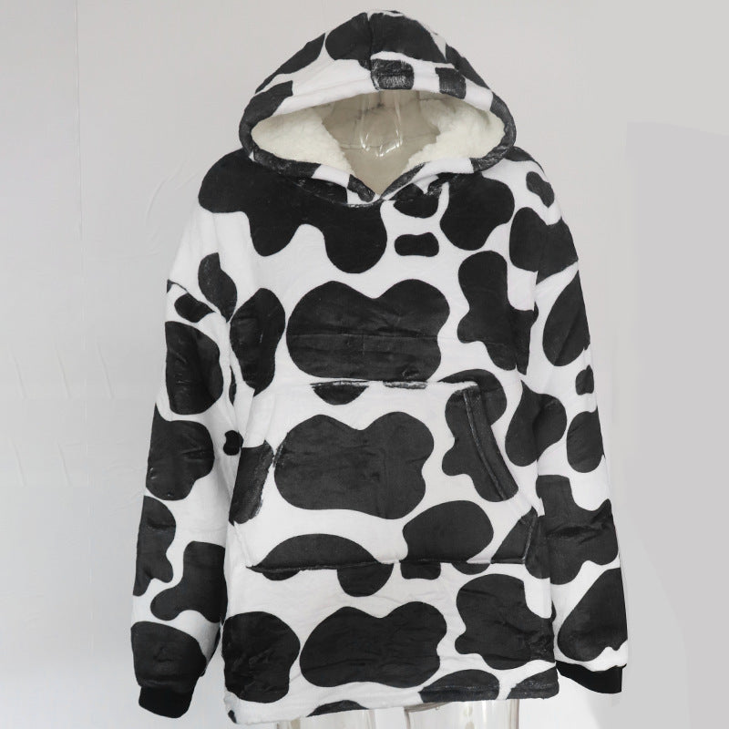 Person wearing oversized panda hooded blanket