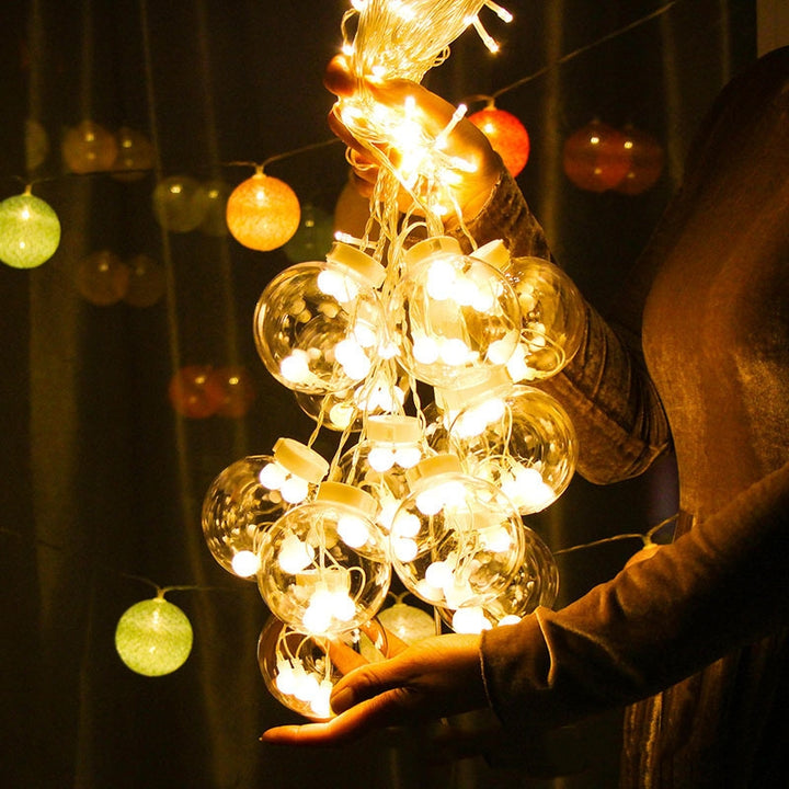 Warm white LED orb curtain lights in window