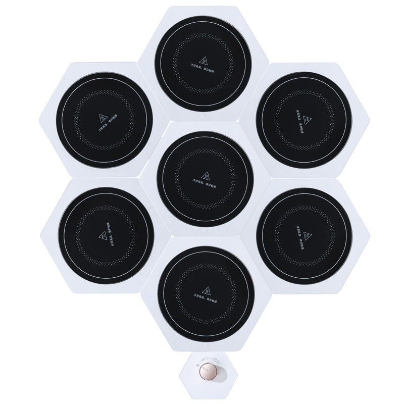 White hexagonal warming plates with dishes on top