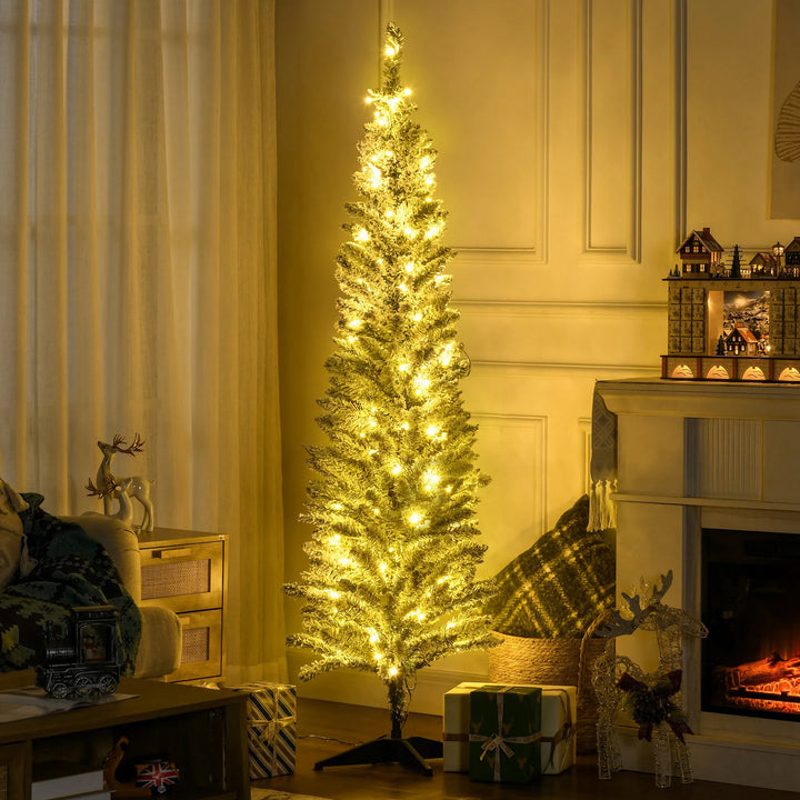 Slim white-flocked pencil tree with warm lights