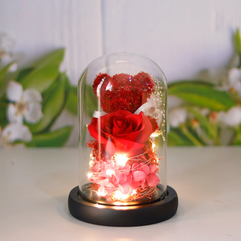 Light-up teddy bear and eternal rose in a glass dome