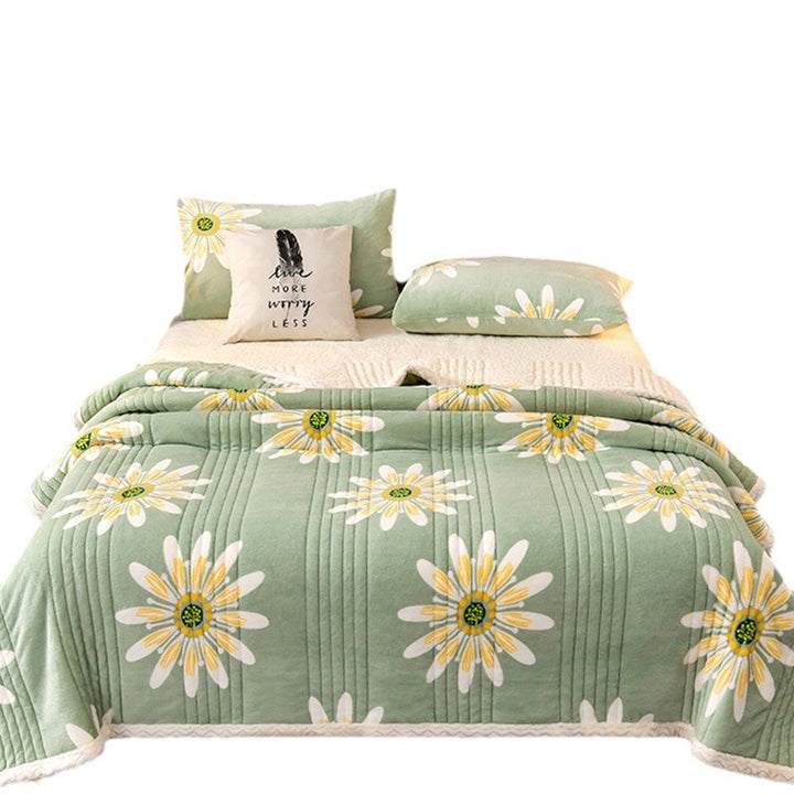 Quilted sherpa blanket with green daisy print