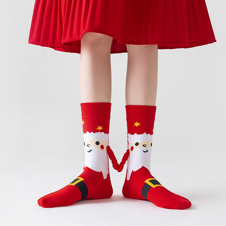 Christmas socks with magnetic hands linked