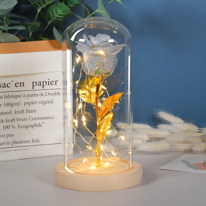 Preserved red rose in lit glass dome
