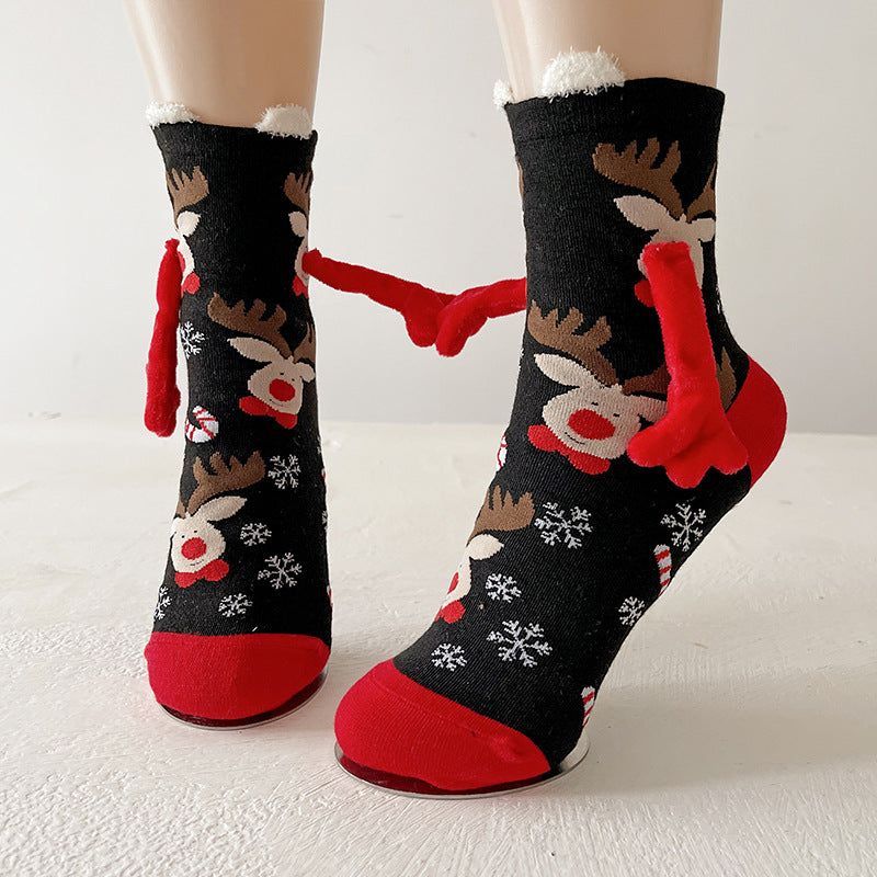Christmas socks with magnetic hands linked