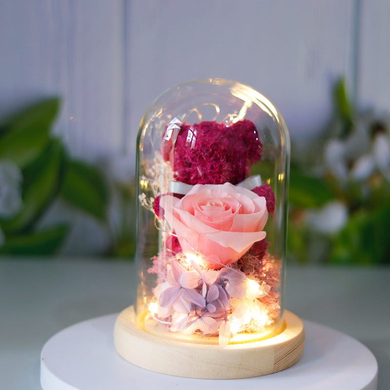 Light-up teddy bear and eternal rose in a glass dome