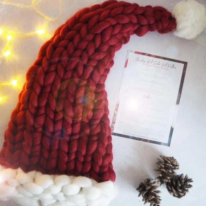 Red chunky knit Christmas hat with white pompom