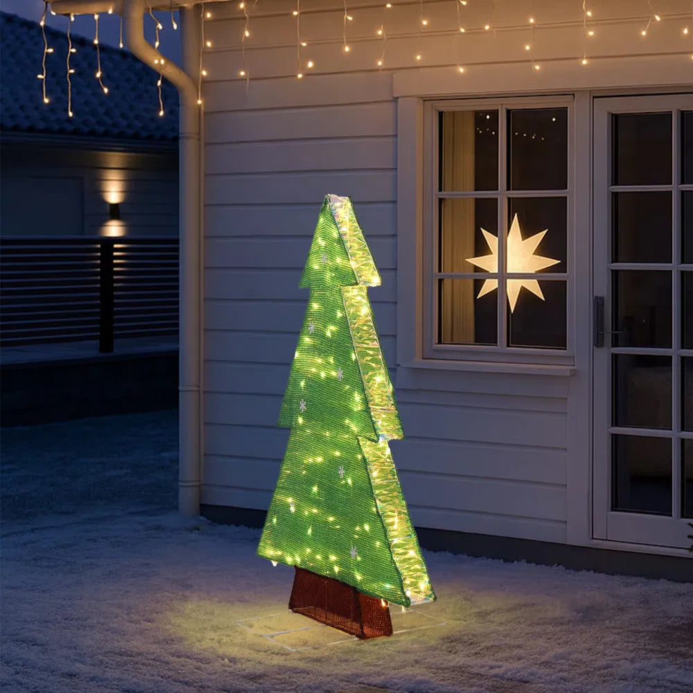 Lit tinsel Christmas tree silhouette outdoors