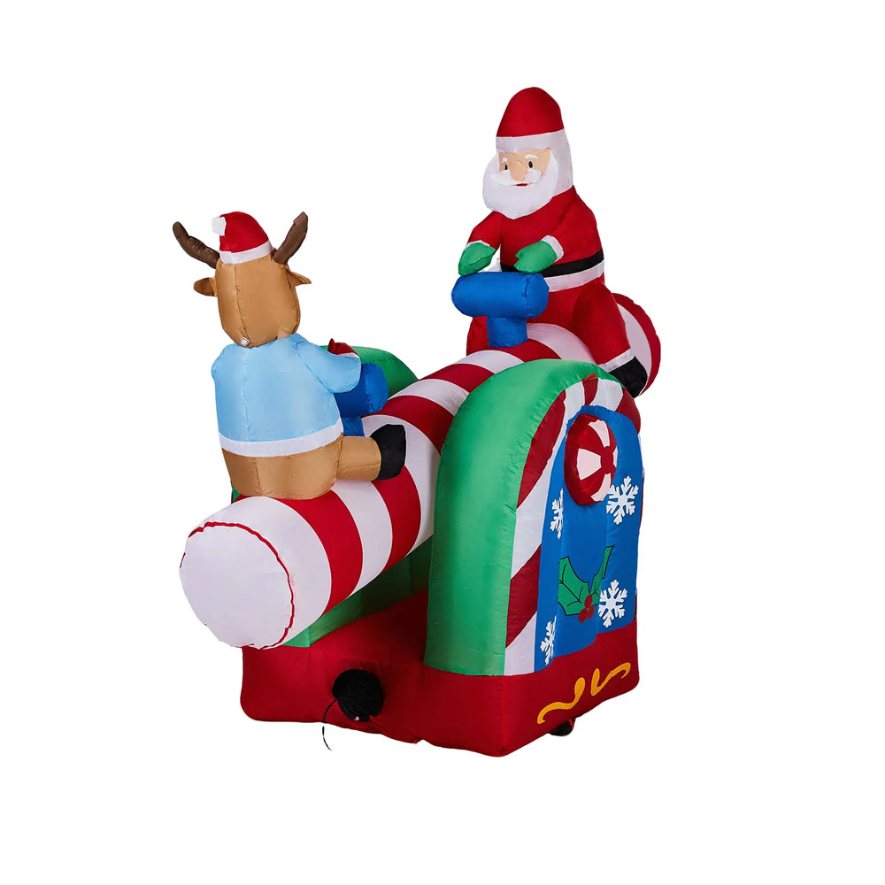 Inflatable Santa and reindeer on seesaw
