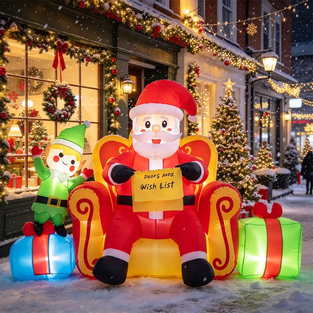 Inflatable Santa on sofa with elf