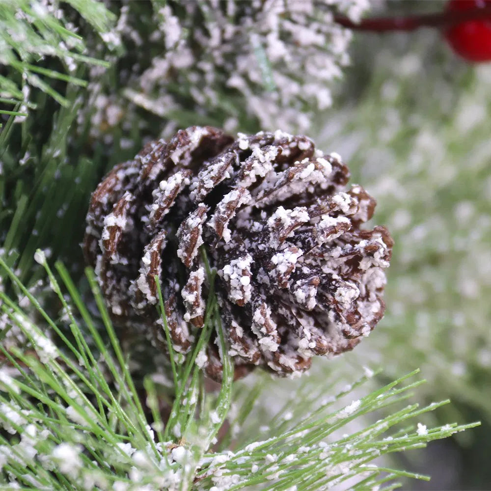 Lit wreath with pine cones and red berries