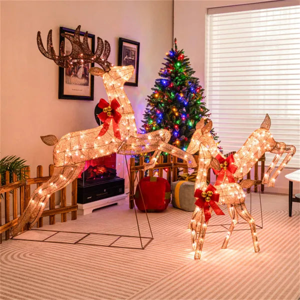 Three glitter reindeer with red bows lit
