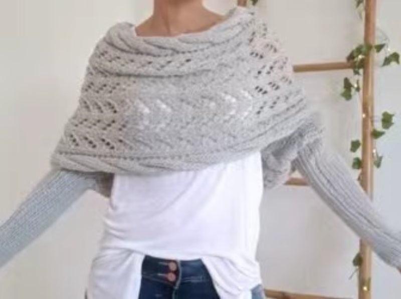 Woman in knitted shrug shawl with sleeves
