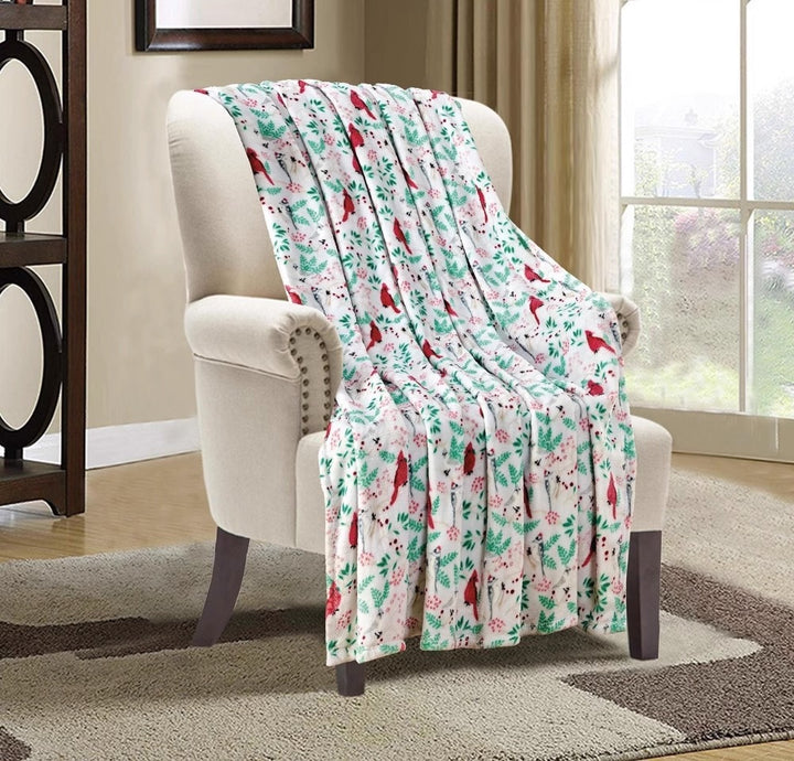 Christmas fleece throw blanket on a sofa