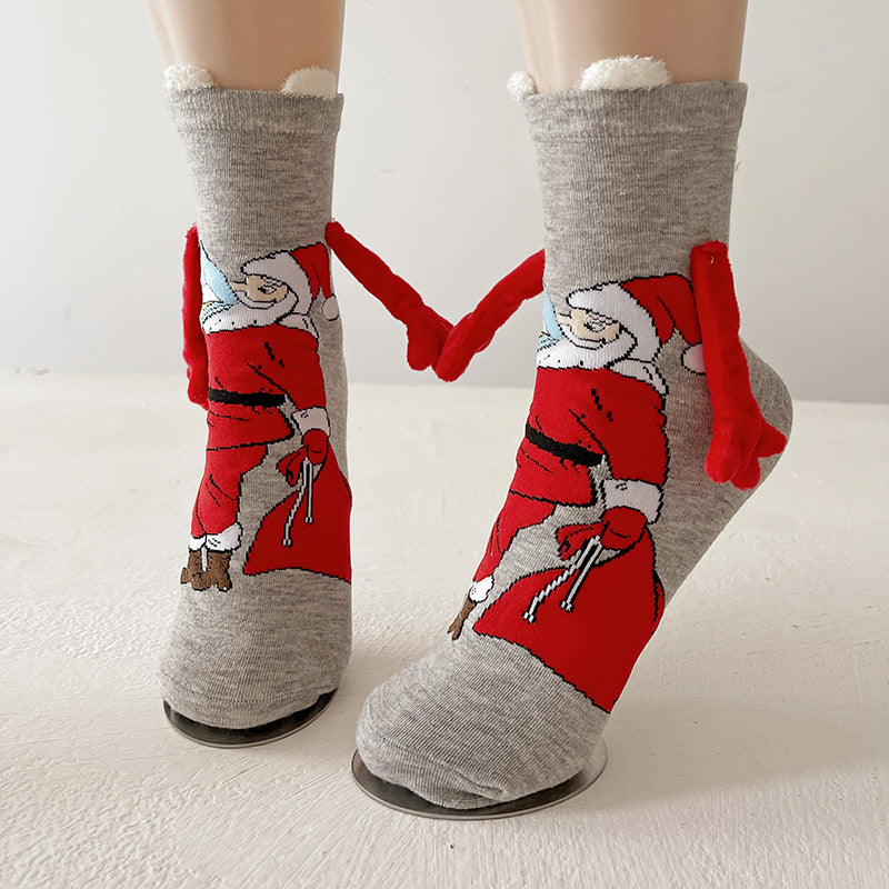 Christmas socks with magnetic hands linked
