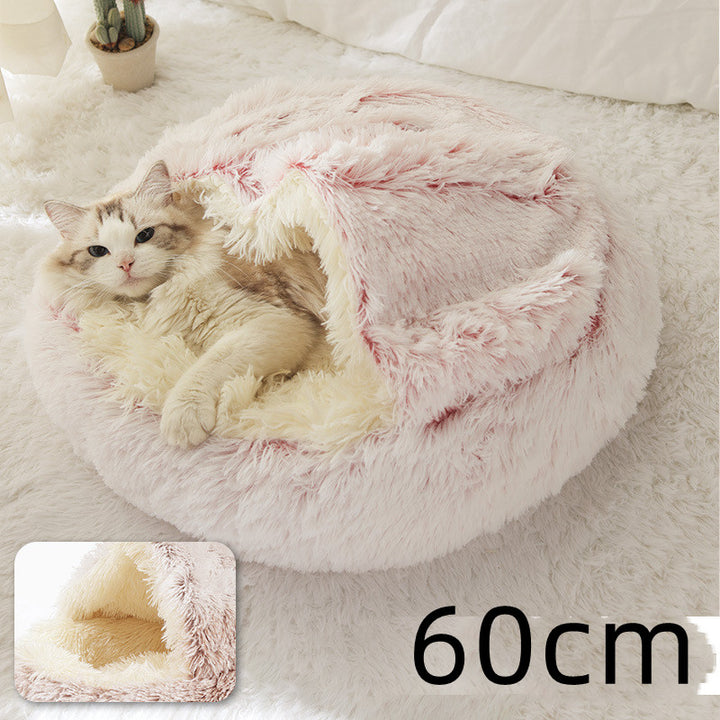 Cat curled in round plush hooded pet bed
