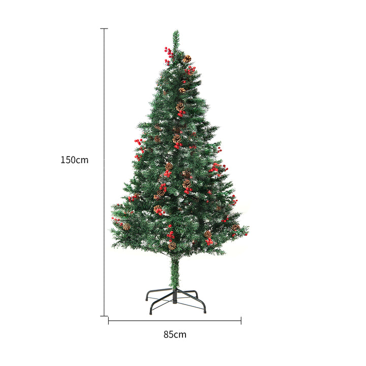Snow-flocked Christmas tree with warm-white lights