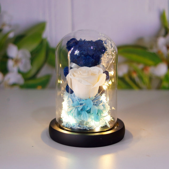 Light-up teddy bear and eternal rose in a glass dome