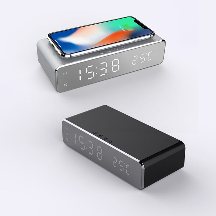 Mirror LED alarm clock charging a phone