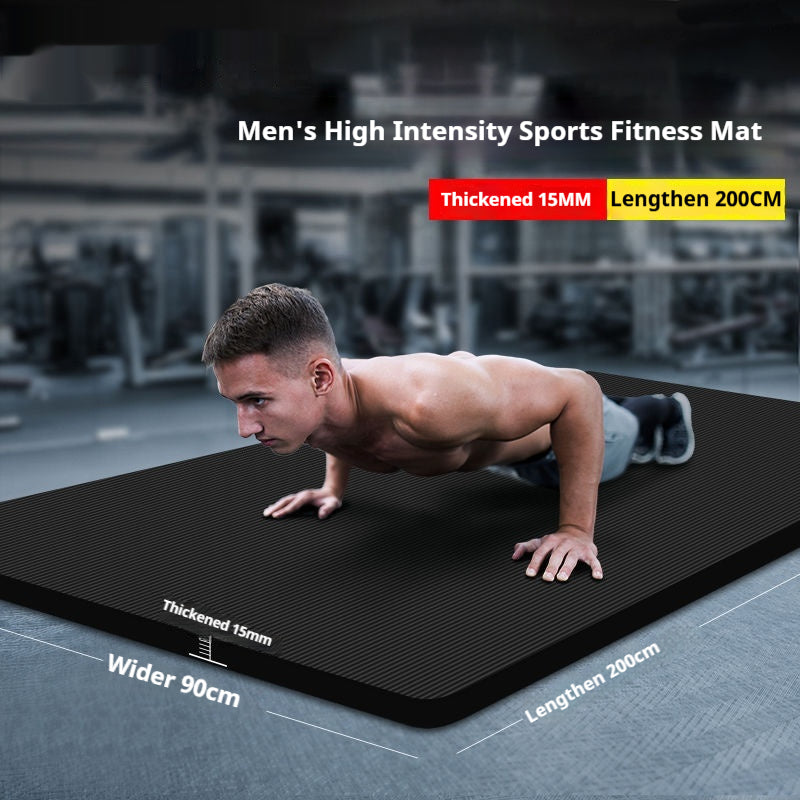 Thick grey exercise mat rolled with carry strap