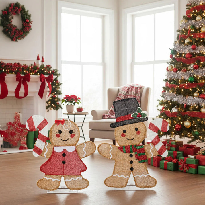 Two light-up gingerbread figures with candy canes