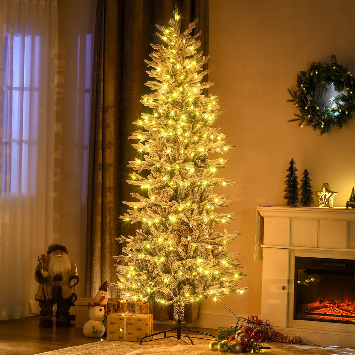 Tall snow-flocked tree with clear lights