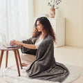 Blue fleece blanket shawl folded into cushion