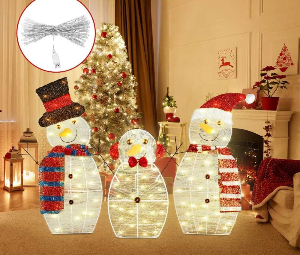 Three plush light-up snowman figures