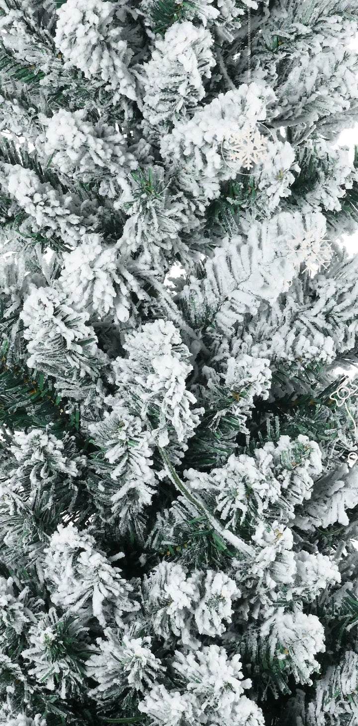 Slim white-flocked pencil tree with warm lights