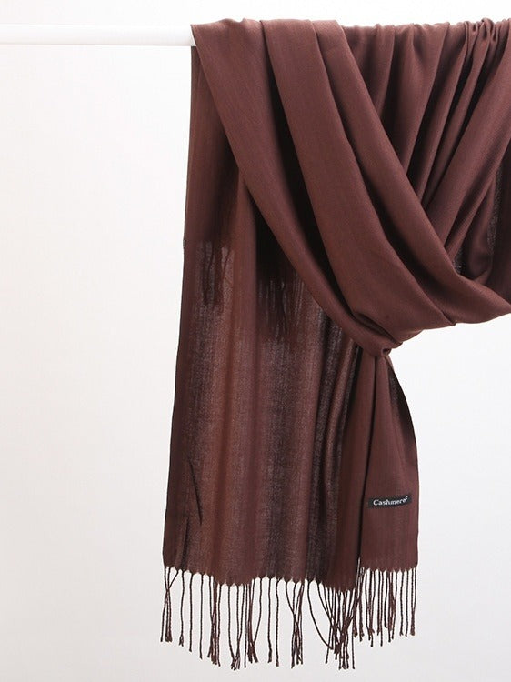 Woman in soft fringed scarf