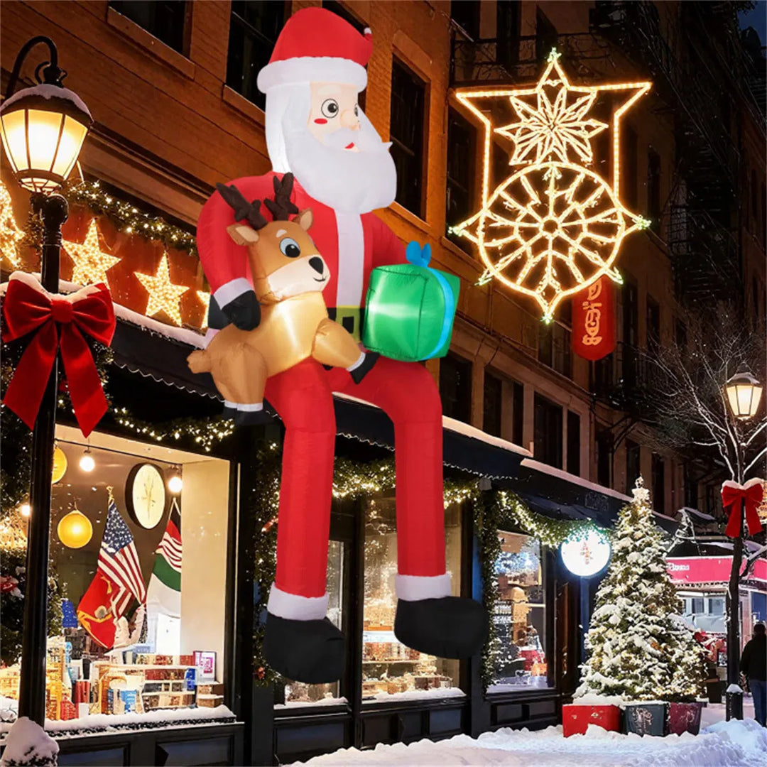 Giant inflatable Santa sitting with reindeer