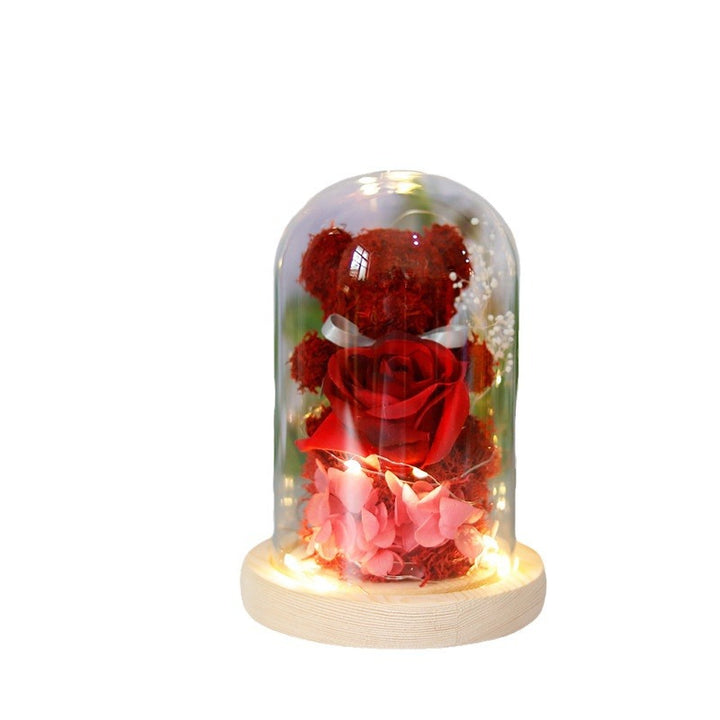 Light-up teddy bear and eternal rose in a glass dome