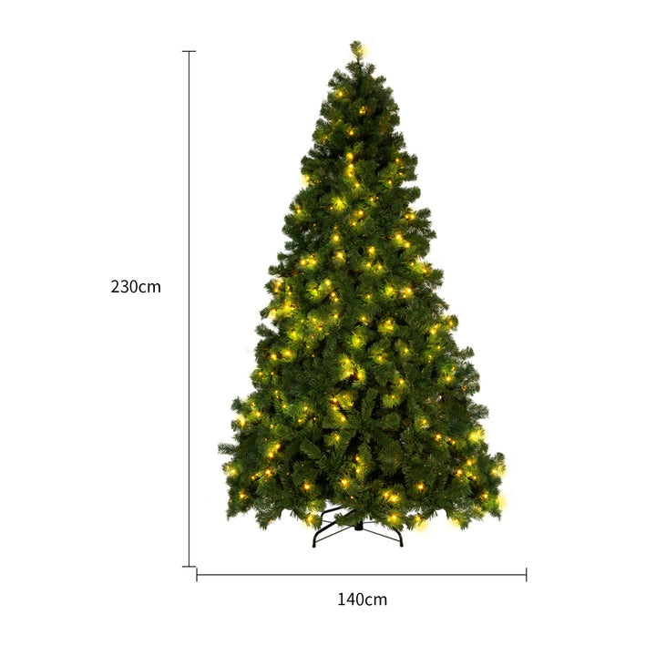 Snow-flocked Christmas tree with warm-white lights