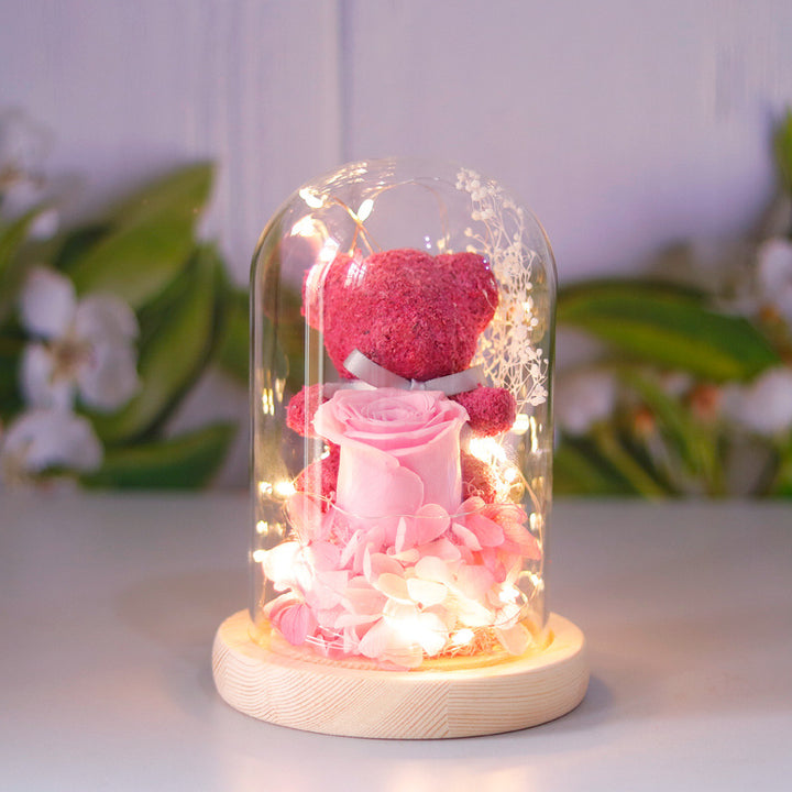 Light-up teddy bear and eternal rose in a glass dome