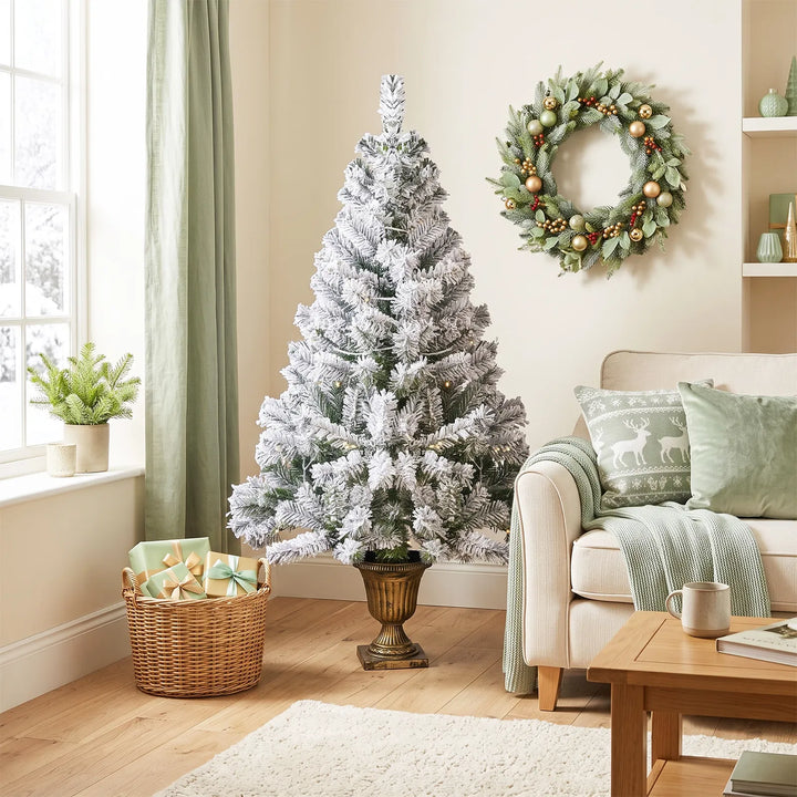 Small flocked tree in a decorative pot