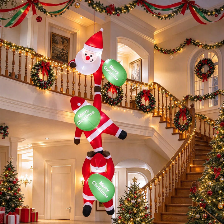 Three inflatable Santas climbing