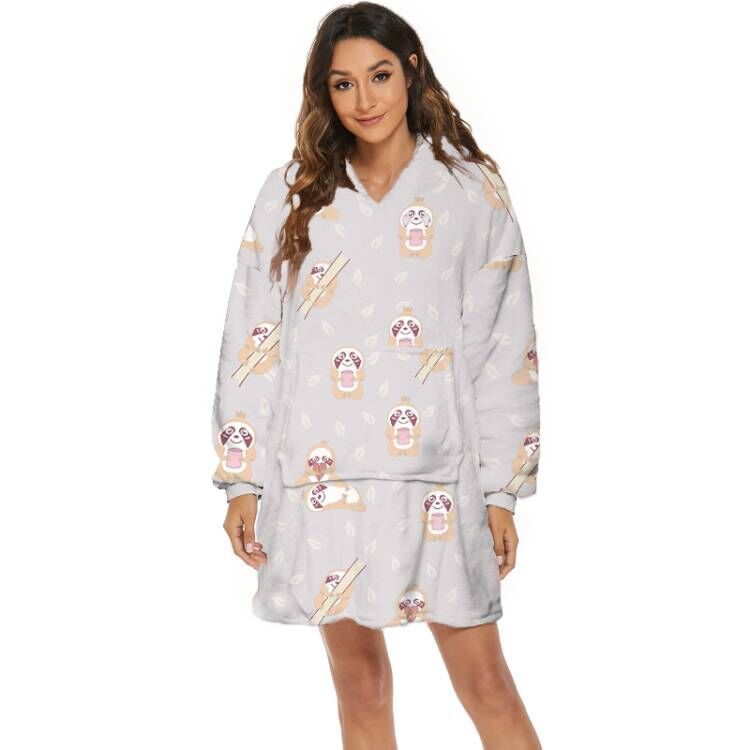 Person wearing oversized panda hooded blanket